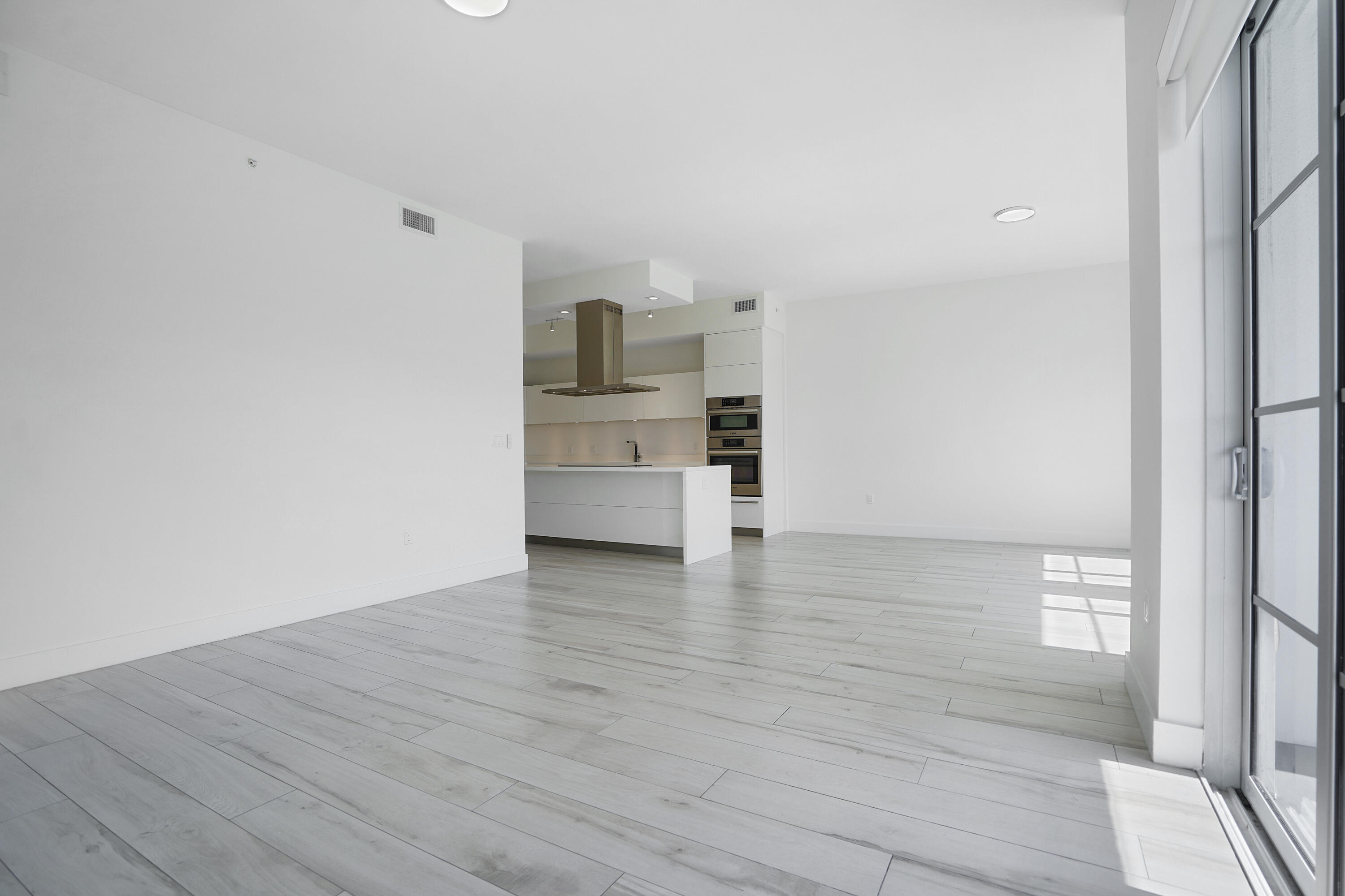 155 East Boca Raton Road, Unit 816 Boca Raton, FL 33432 - Photo 8 of 60 a view of kitchen and wooden floor