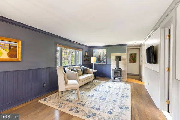 a living room with furniture and a rug