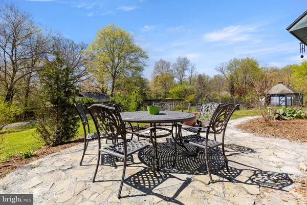 a view of a backyard with sitting area