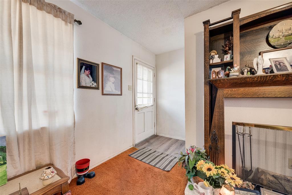 110 Hackberry Street Lancaster, TX 75146 - Photo 7 of 31 This is not a fireplace, there are just electric logs located here and the mantle will not remain with the property.