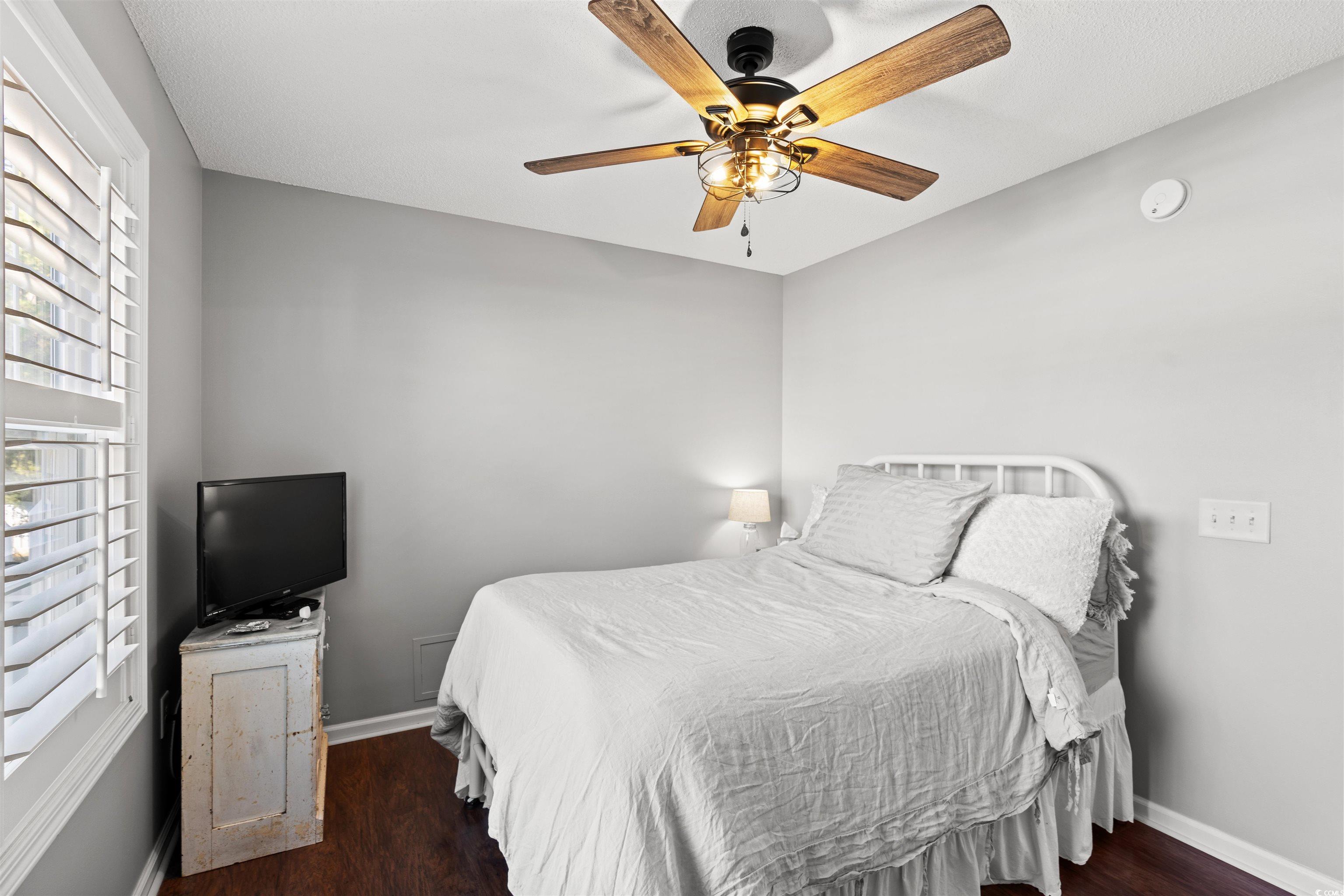 712 Potters Alley Murrells Inlet, SC 29576 - Photo 17 of 32 Bedroom with ceiling fan and dark hardwood / wood-