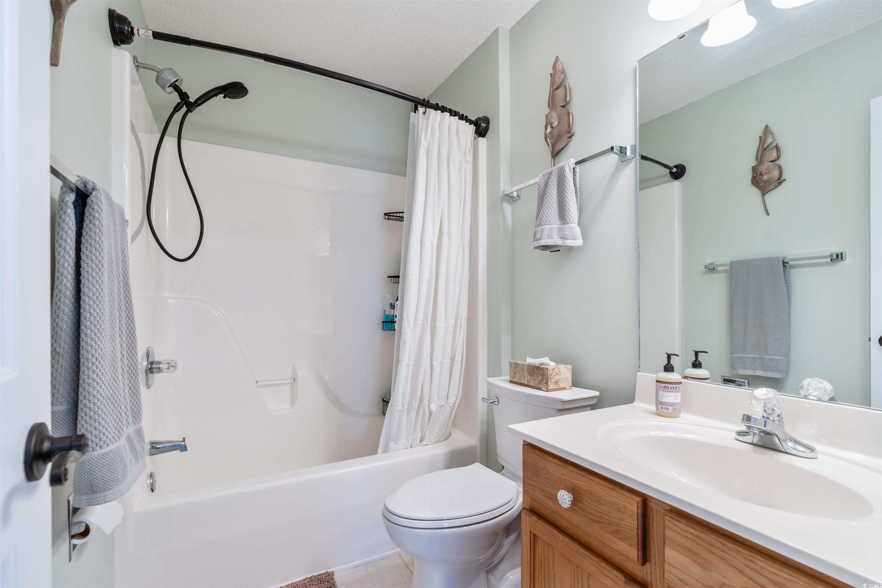 712 Potters Alley Murrells Inlet, SC 29576 - Photo 18 of 32 Full bathroom with toilet, a textured ceiling, van