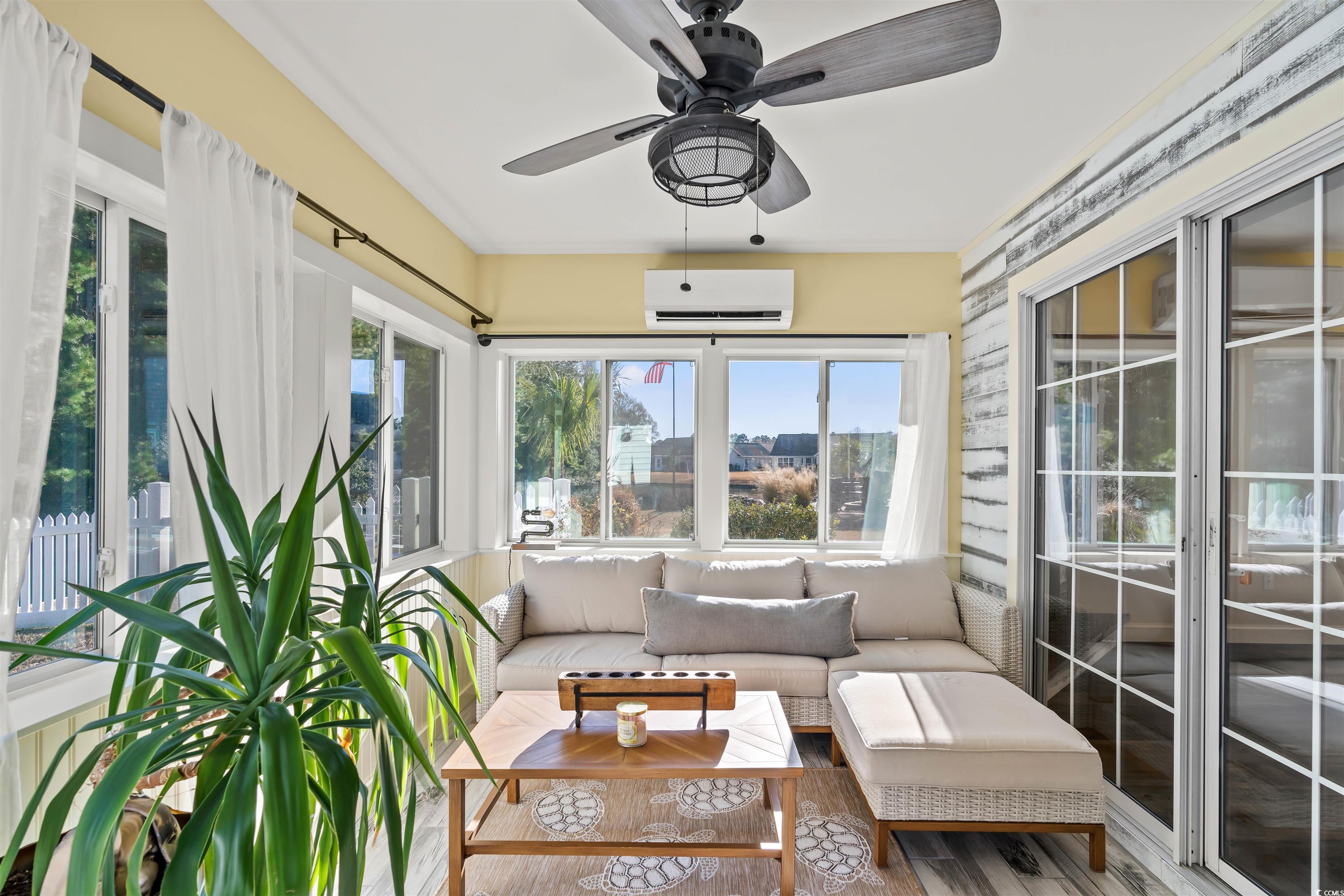 712 Potters Alley Murrells Inlet, SC 29576 - Photo 24 of 32 Sunroom featuring a wall mounted AC and ceiling fa