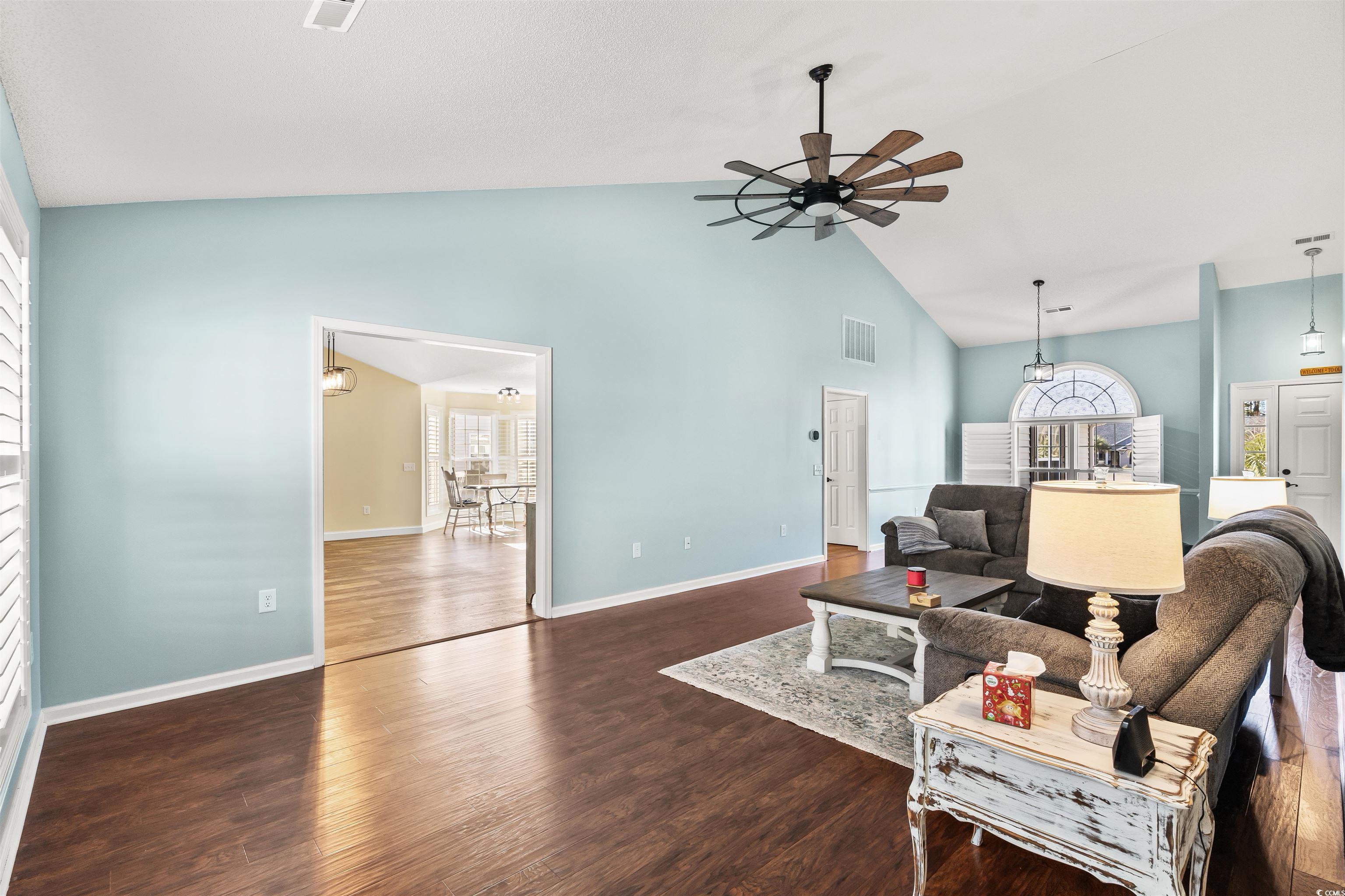 712 Potters Alley Murrells Inlet, SC 29576 - Photo 5 of 32 Living room featuring ceiling fan, dark hardwood /