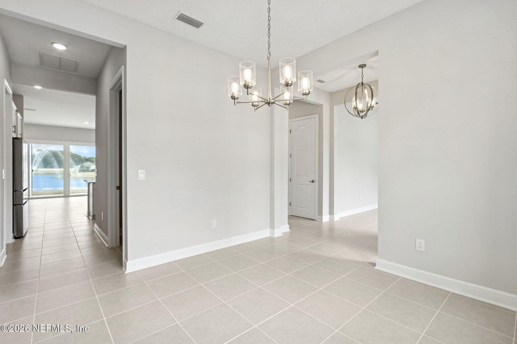 85321 Sandy Rdg Loop Yulee, FL 32097 - Photo 13 of 49 a view of a chandelier fan and entryway