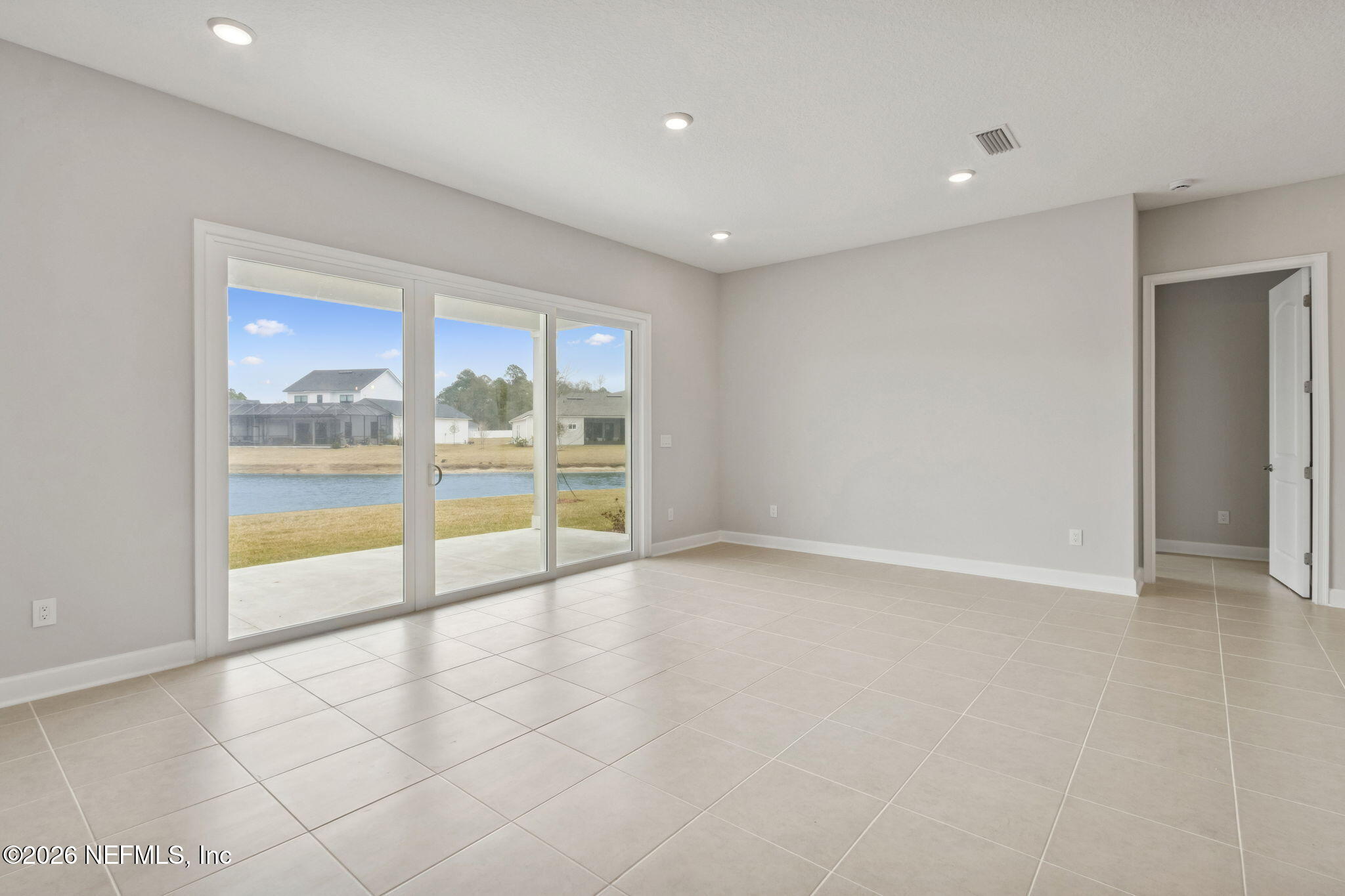 85321 Sandy Rdg Loop Yulee, FL 32097 - Photo 15 of 49 an empty room with sliding glass door and shower