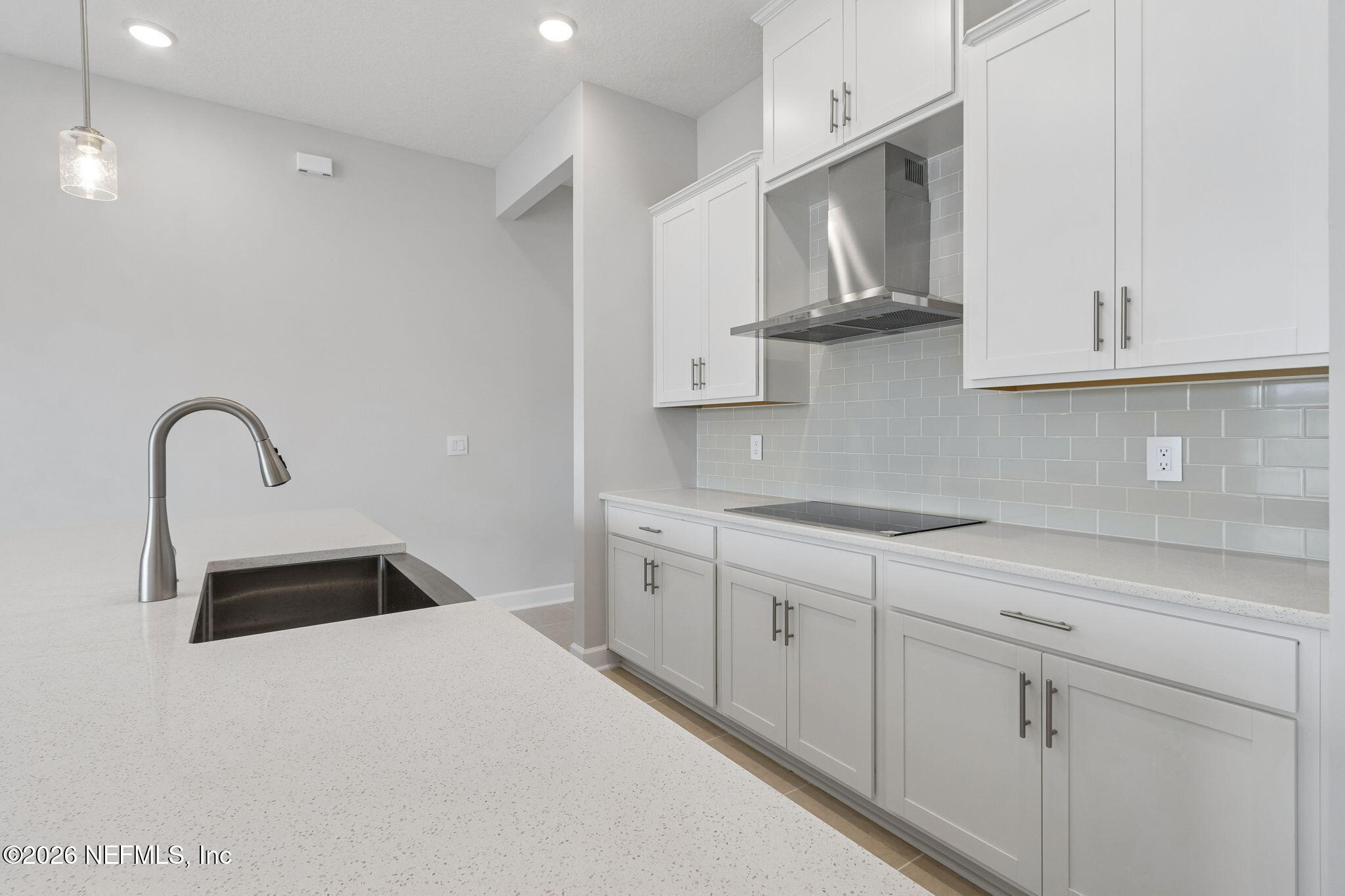 85321 Sandy Rdg Loop Yulee, FL 32097 - Photo 17 of 49 a kitchen with stainless steel appliances granite countertop a sink stove and cabinets