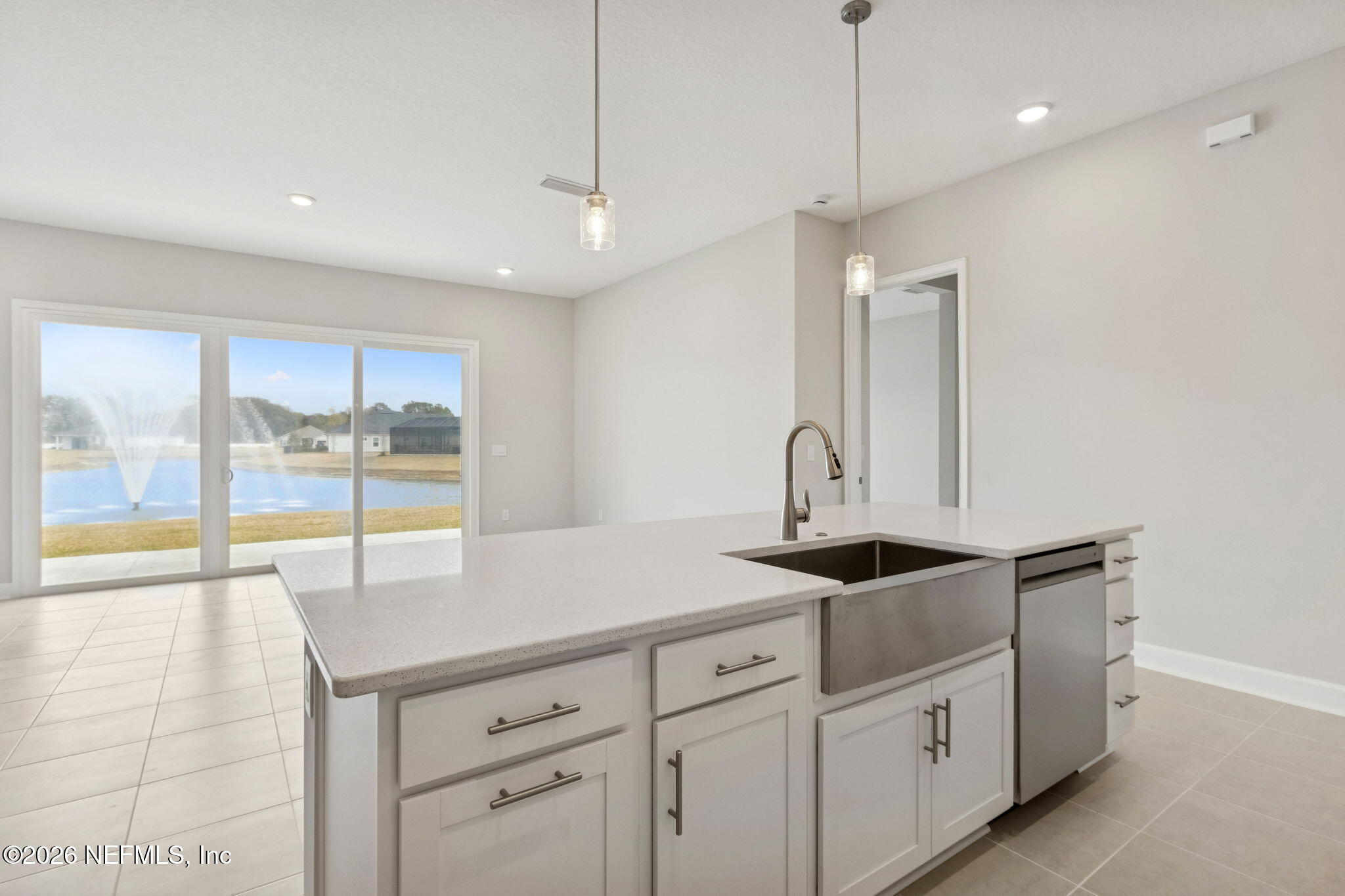 85321 Sandy Rdg Loop Yulee, FL 32097 - Photo 18 of 49 a kitchen with granite countertop a sink a counter top space and cabinets