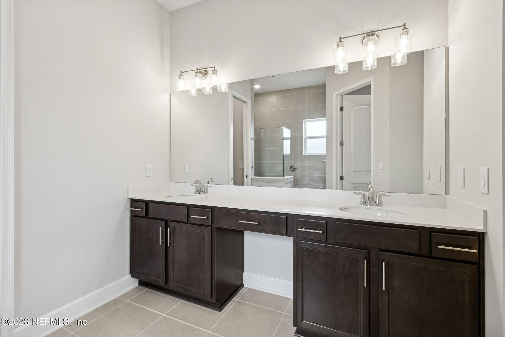 85321 Sandy Rdg Loop Yulee, FL 32097 - Photo 27 of 49 a bathroom with a sink and a mirror
