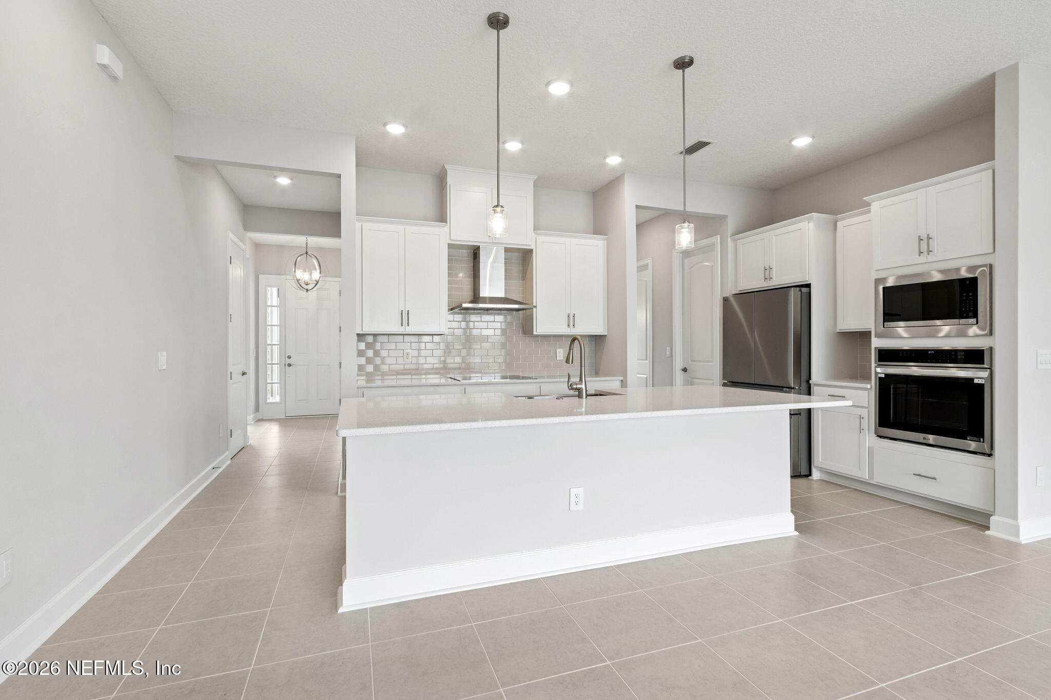 85321 Sandy Rdg Loop Yulee, FL 32097 - Photo 3 of 49 a large room with kitchen view and a view of living room