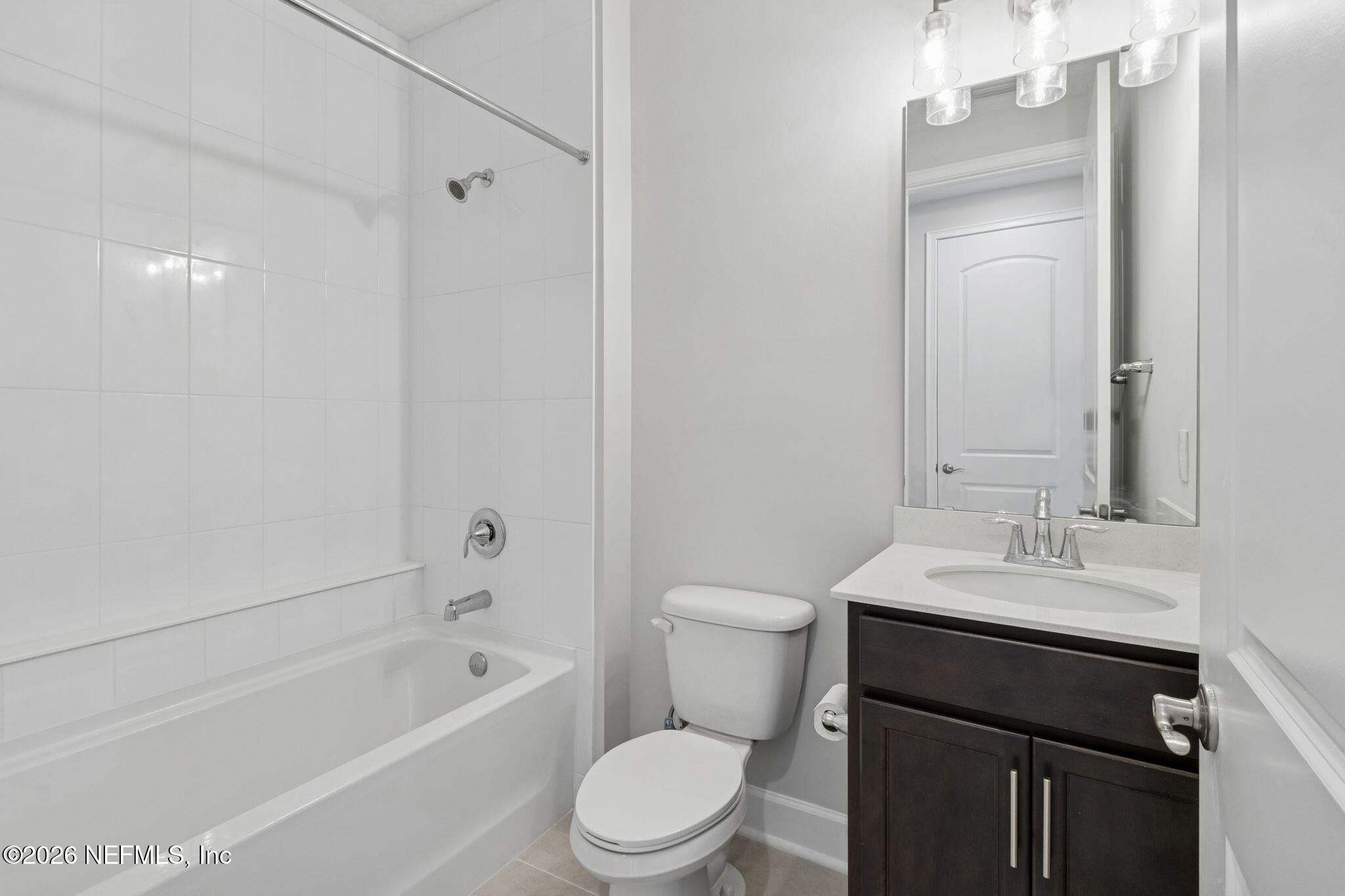 85321 Sandy Rdg Loop Yulee, FL 32097 - Photo 38 of 49 a bathroom with a sink a toilet and shower