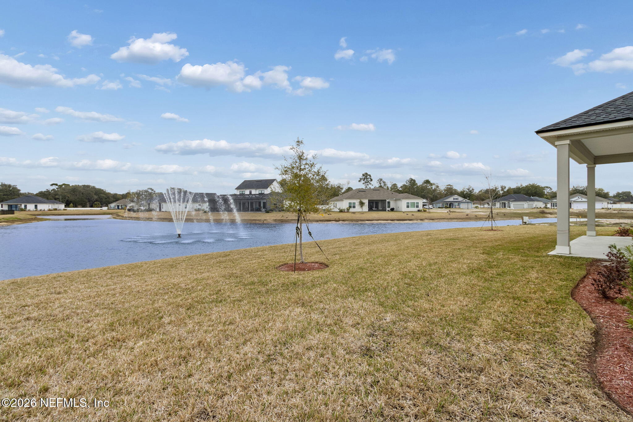 85321 Sandy Rdg Loop Yulee, FL 32097 - Photo 43 of 49 a view of a lake with houses