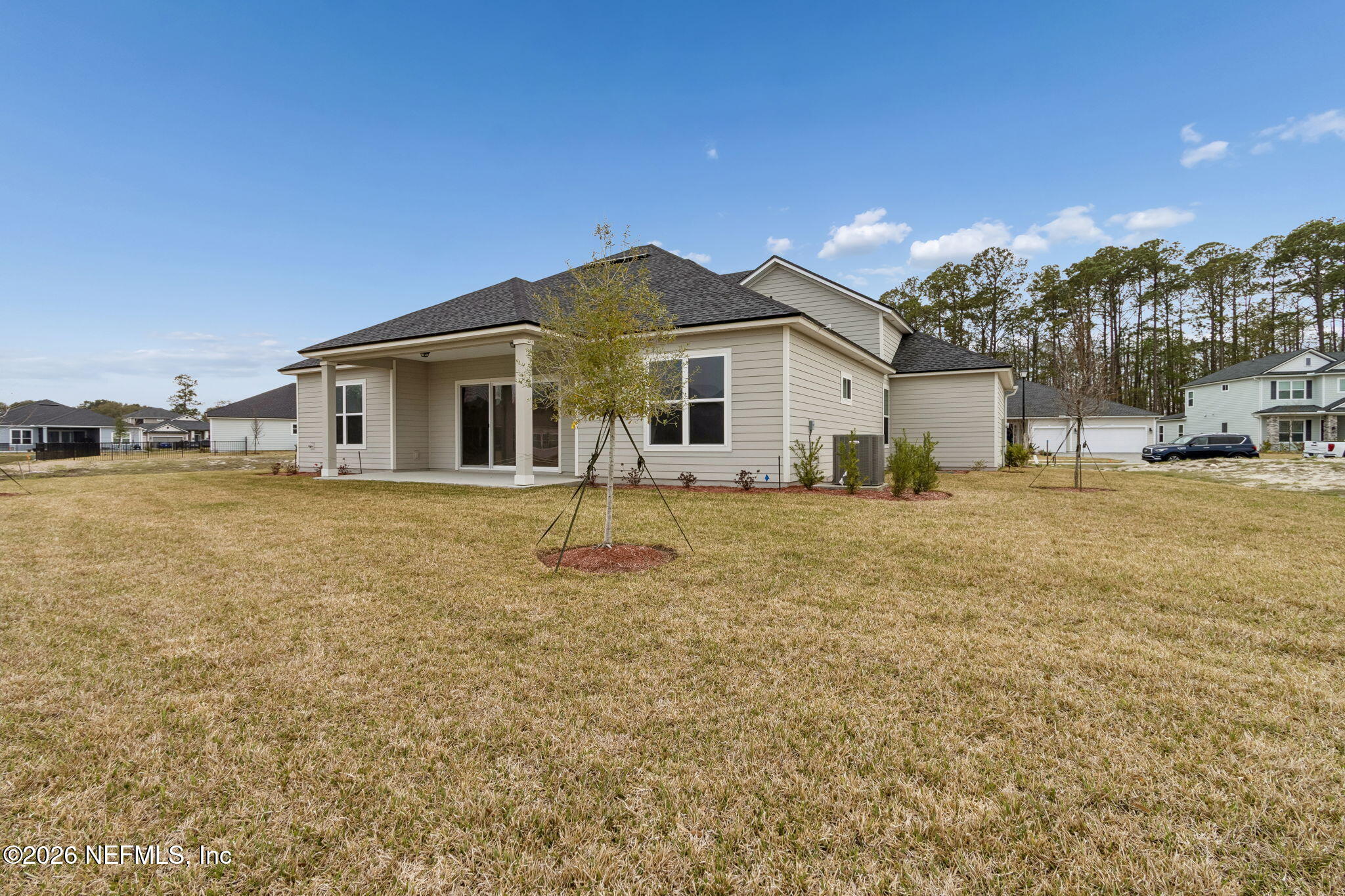 85321 Sandy Rdg Loop Yulee, FL 32097 - Photo 44 of 49 a front view of a house with a yard