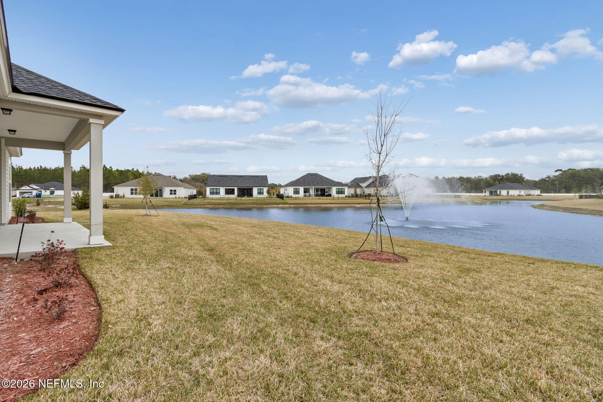 85321 Sandy Rdg Loop Yulee, FL 32097 - Photo 46 of 49 a view of a lake with outdoor space