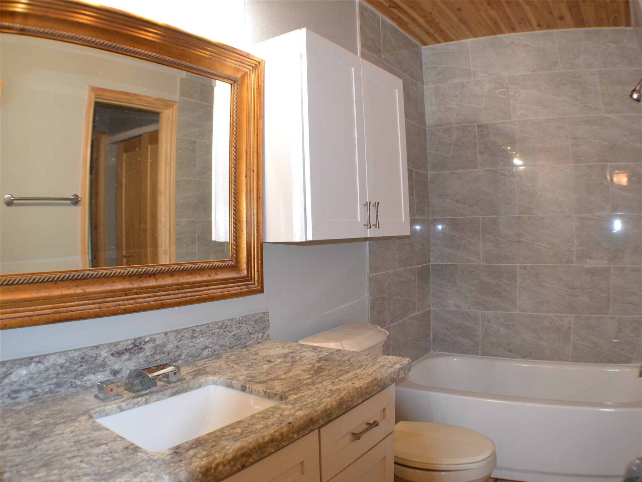 30 Putters Point West Point Blank, TX 77364 - Photo 14 of 20 Fully remodeled upstairs bathroom with tub shower combo adjoins both bedrooms