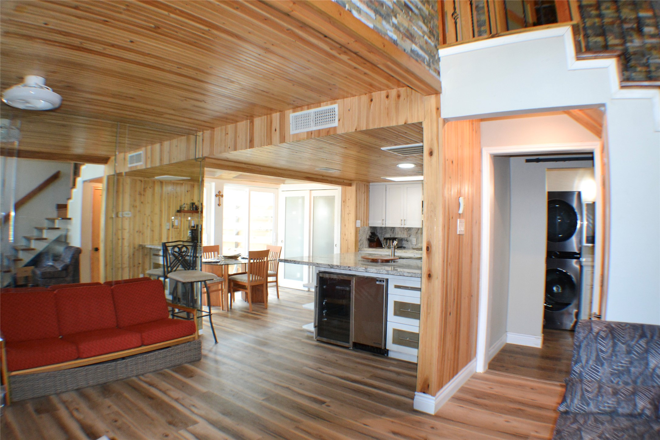 30 Putters Point West Point Blank, TX 77364 - Photo 6 of 20 Kitchen open to living and dining areas overlooking the private side patio area with floor to ceiling sliding windows