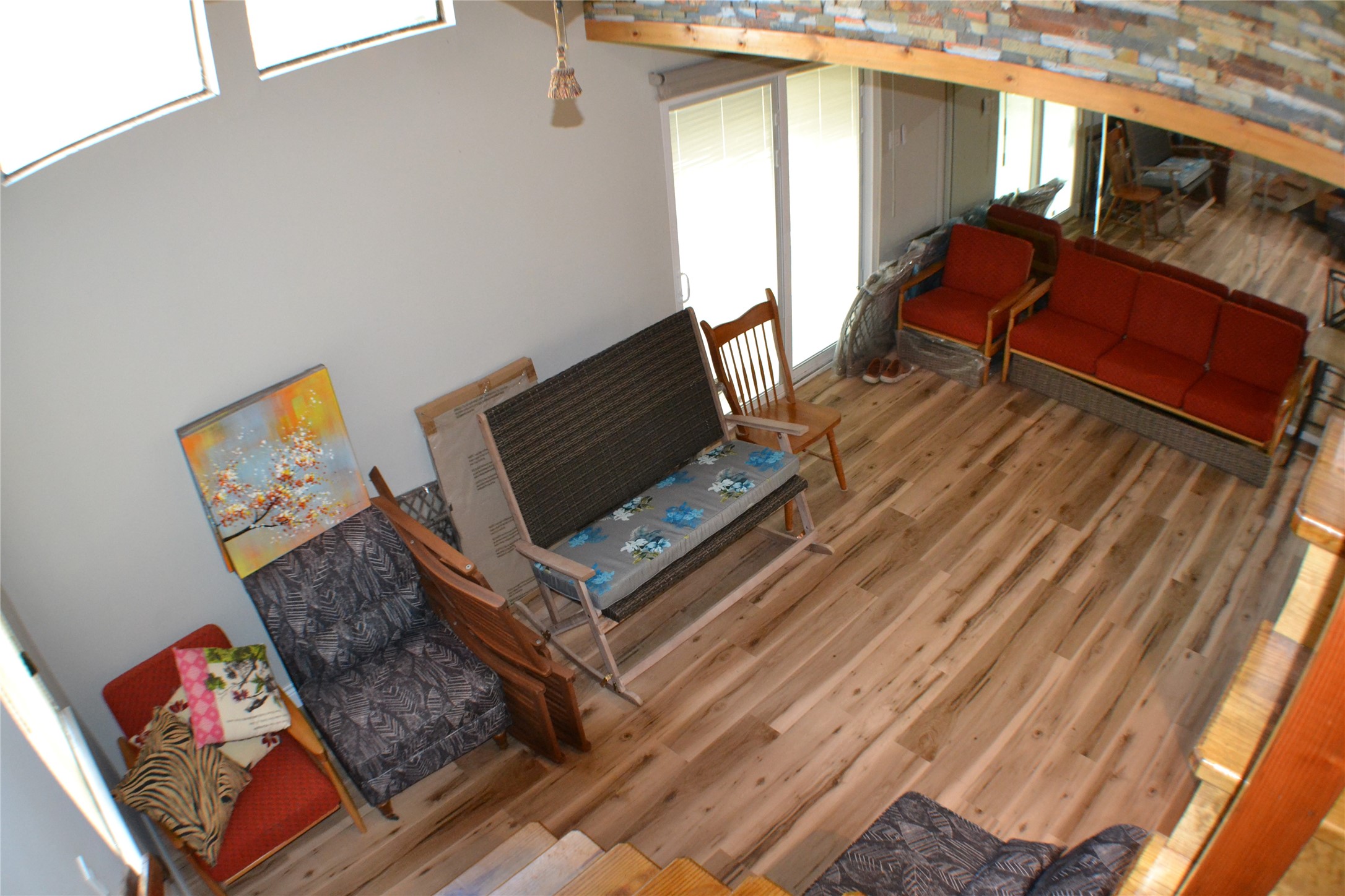 30 Putters Point West Point Blank, TX 77364 - Photo 9 of 20 A view of the living room from the stairs show off the luxury vinyl plank flooring