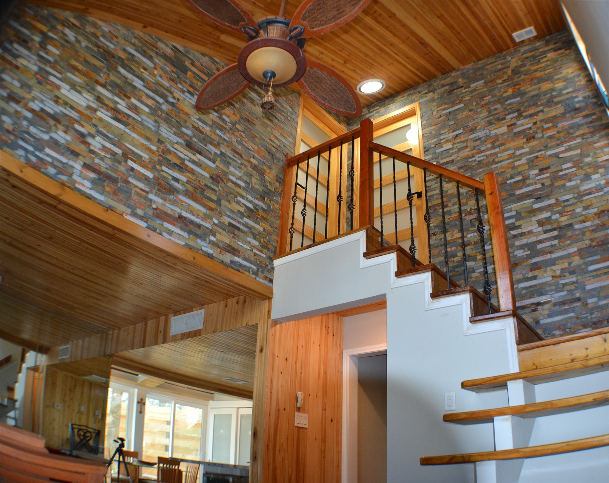 30 Putters Point West Point Blank, TX 77364 - Photo 10 of 20 High ceilings in the living room with cascading stacked stone wall accents