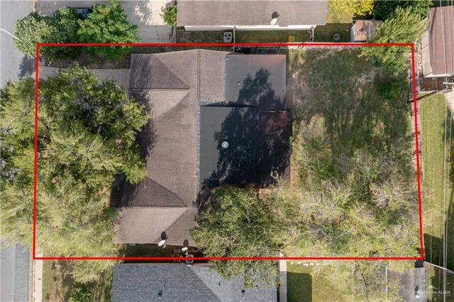 an aerial view of house with yard