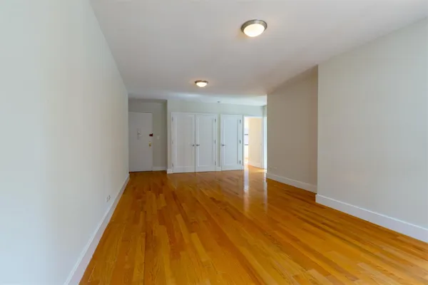a view of room with wooden floor