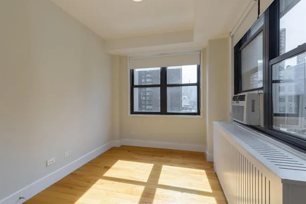 a view of an empty room with a window