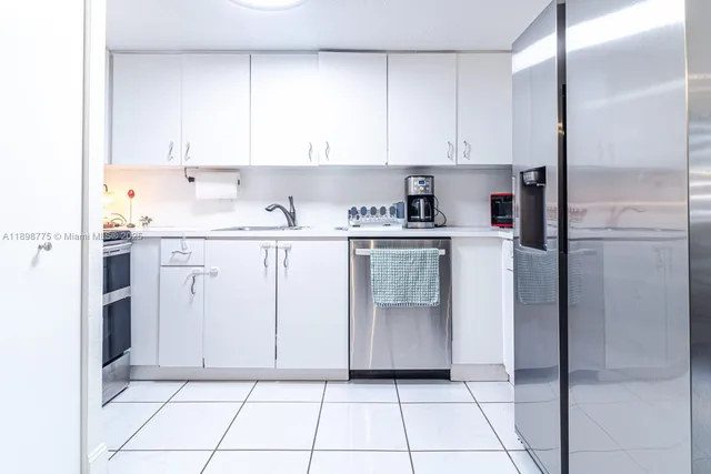 a kitchen with cabinets and window