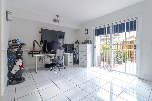 a work room with furniture and a window