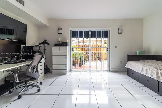 a bedroom with furniture and a window