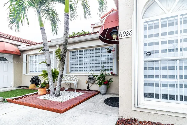 a view of a chairs and table in a patio