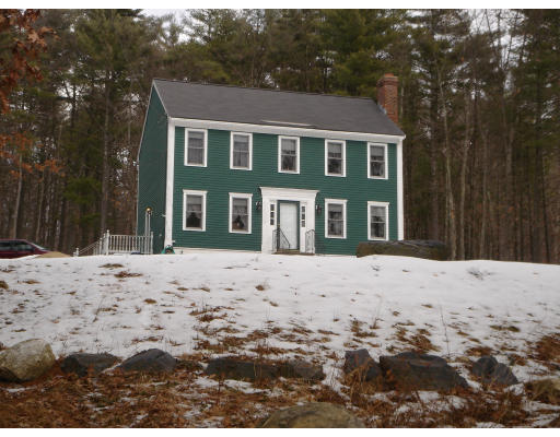 5 Proctor Road Pepperell, MA 01463 - Photo 1 of 12 a front view of a house with a yard