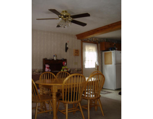 5 Proctor Road Pepperell, MA 01463 - Photo 5 of 12 a view of a dining room with furniture and a chandelier