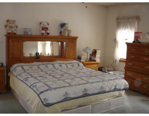 5 Proctor Road Pepperell, MA 01463 - Photo 8 of 12 a bedroom with a bed and dresser