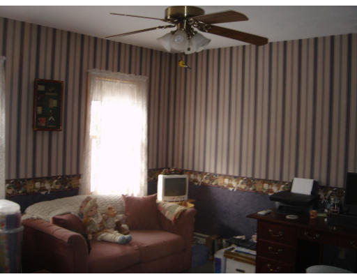 5 Proctor Road Pepperell, MA 01463 - Photo 9 of 12 a living room with furniture and a window