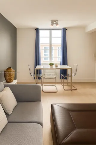 a living room with furniture and a window