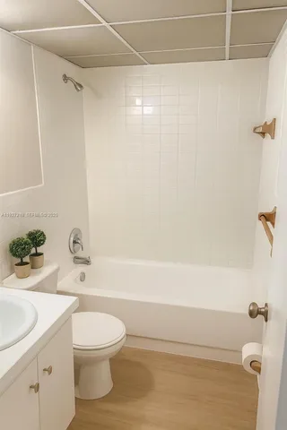 a bathroom with a toilet a sink and bathtub