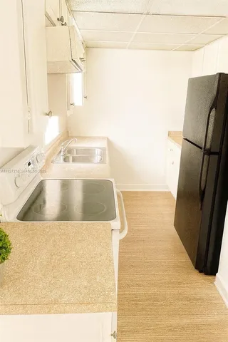 a view of a kitchen with a sink