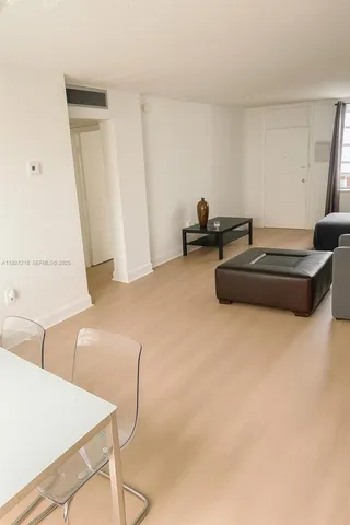 a room with furniture and white walls