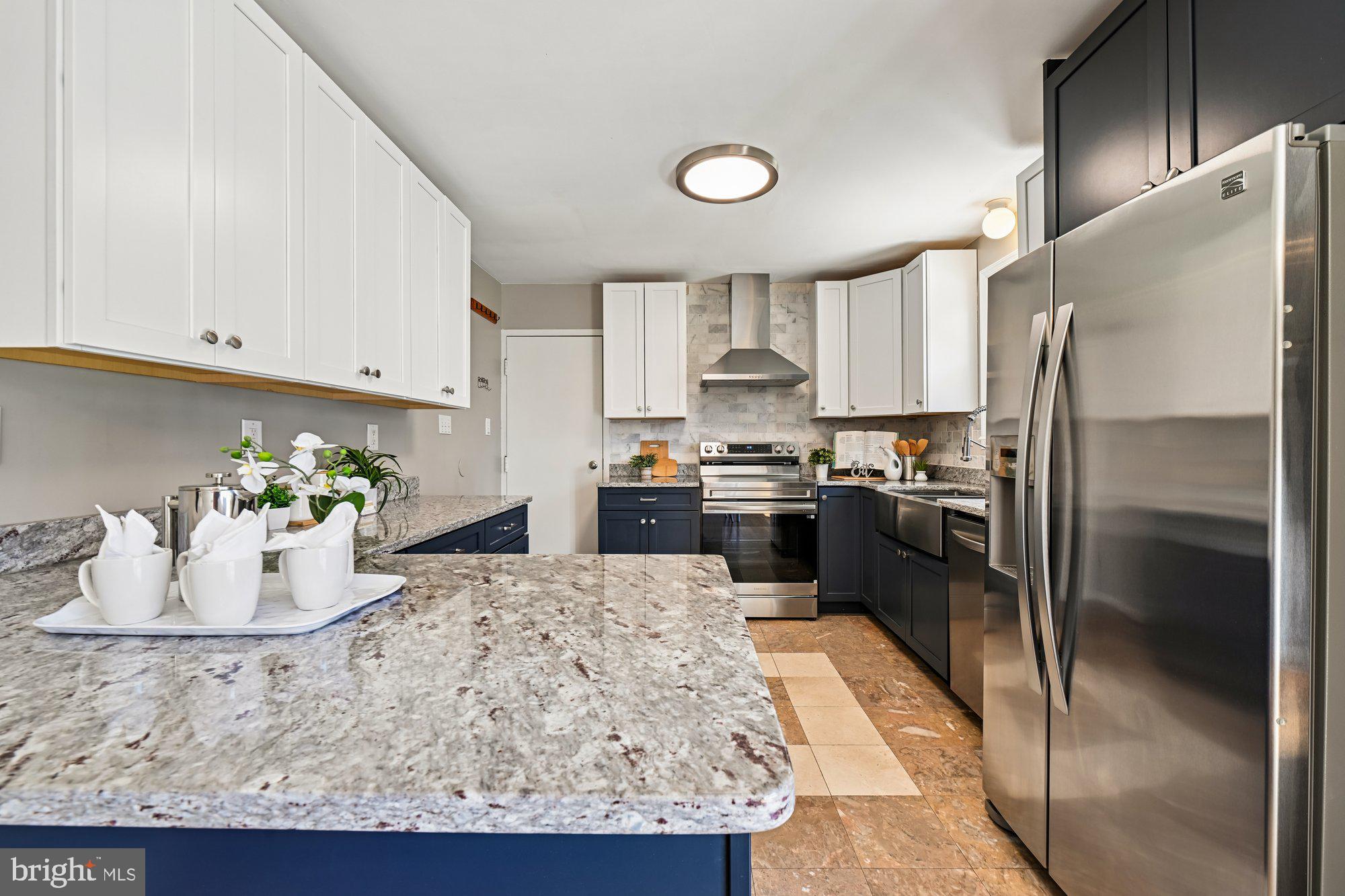 16601 Candy Hill Road Upper Marlboro, MD 20772 - Photo 12 of 55 a kitchen with stainless steel appliances granite countertop a refrigerator a stove and a sink