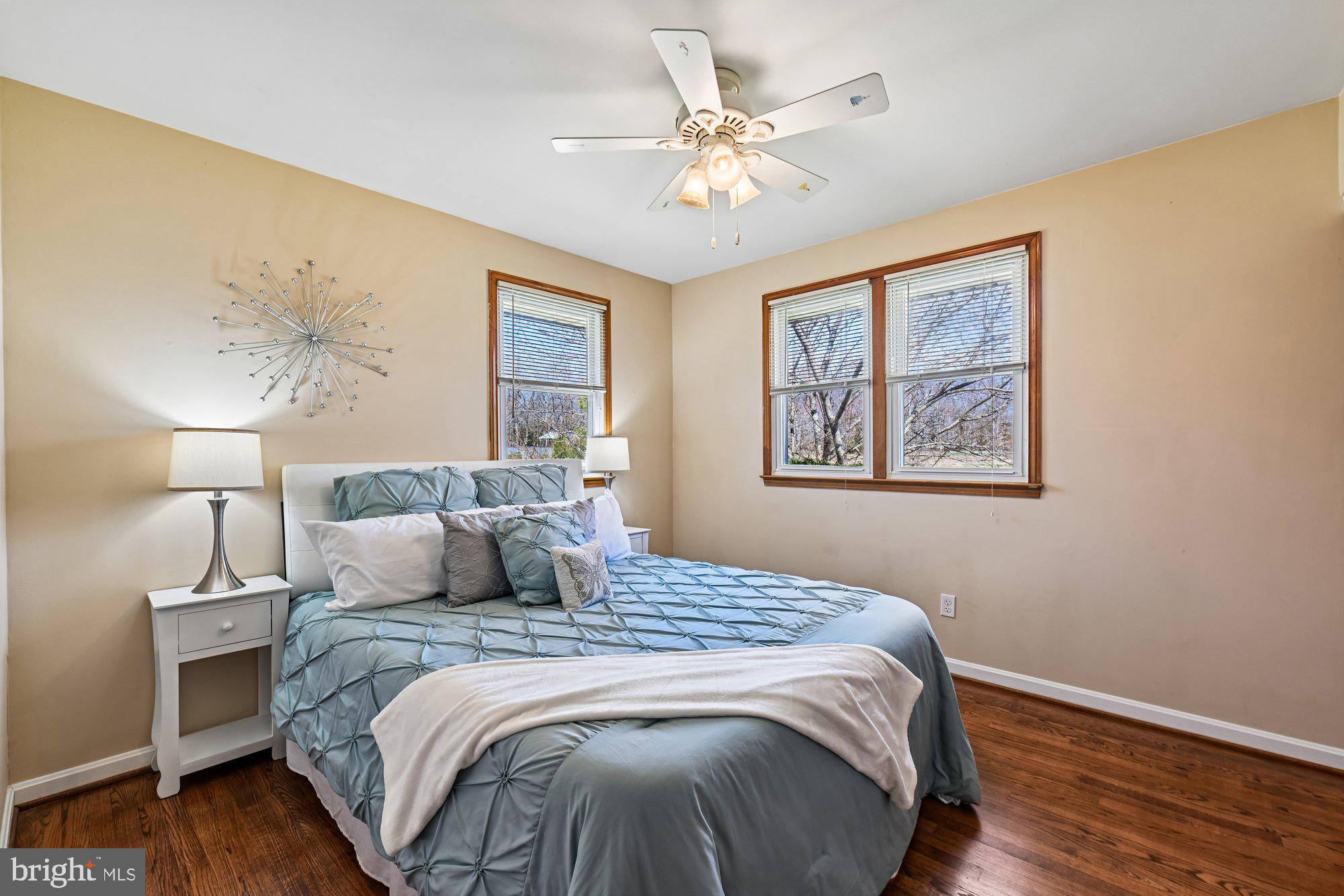 16601 Candy Hill Road Upper Marlboro, MD 20772 - Photo 17 of 55 a bedroom with a large bed and a chandelier