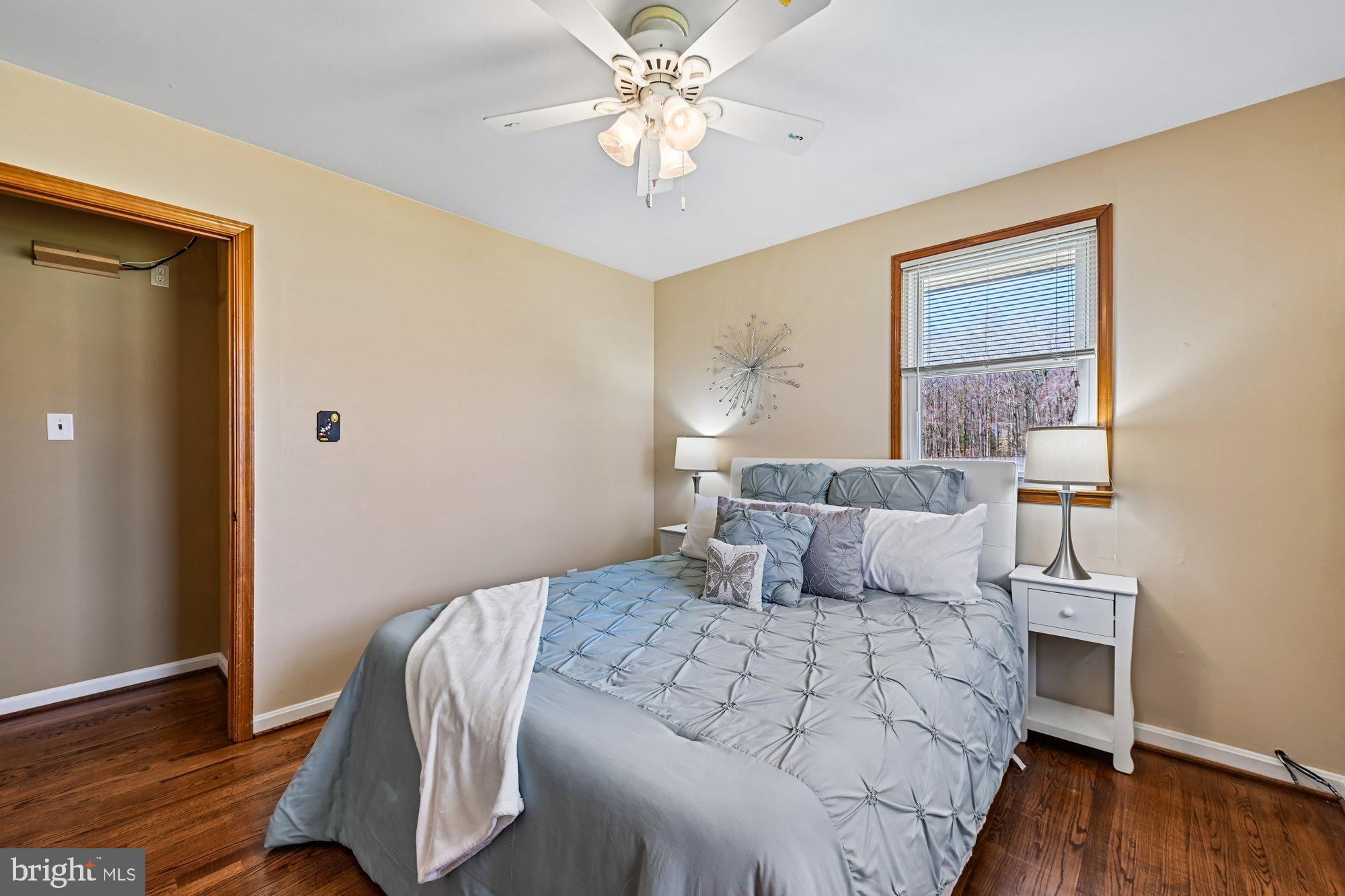 16601 Candy Hill Road Upper Marlboro, MD 20772 - Photo 18 of 55 a bedroom with a bed and wooden floor