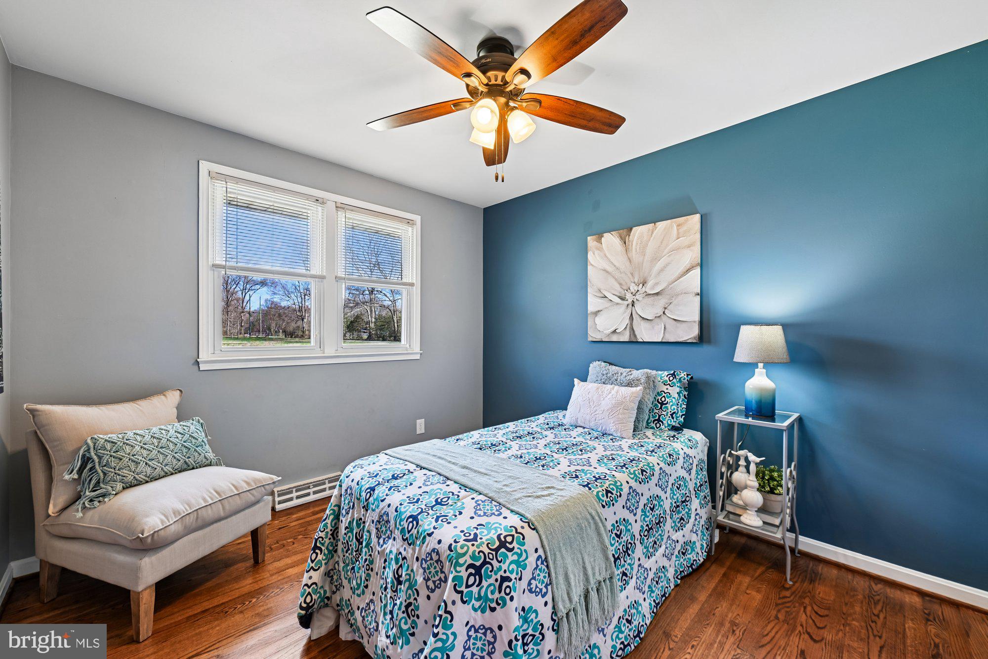 16601 Candy Hill Road Upper Marlboro, MD 20772 - Photo 21 of 55 a bedroom with a bed and a chandelier