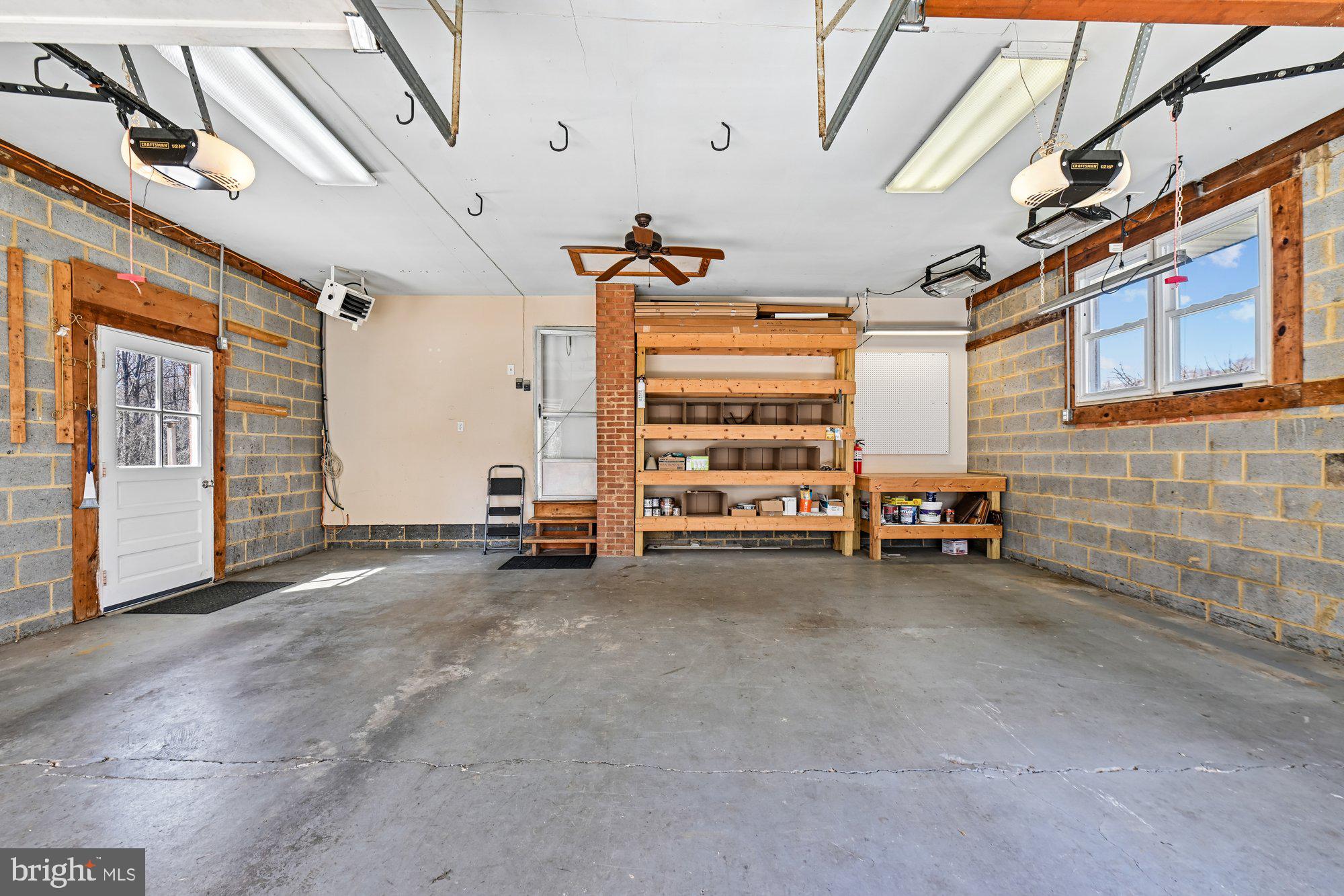 16601 Candy Hill Road Upper Marlboro, MD 20772 - Photo 34 of 55 Garage w/ heating units and built-in shelving