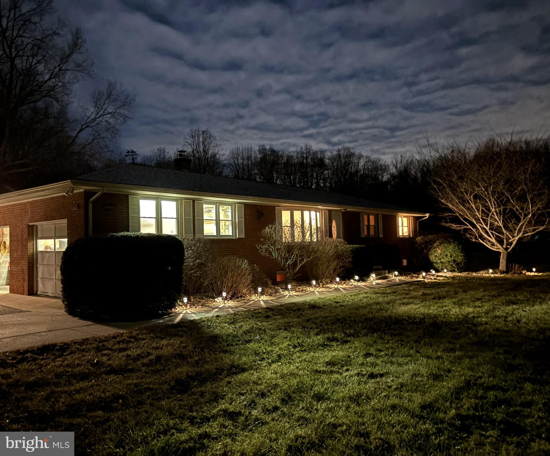 16601 Candy Hill Road Upper Marlboro, MD 20772 - Photo 39 of 55 Evening view with warm exterior lighting