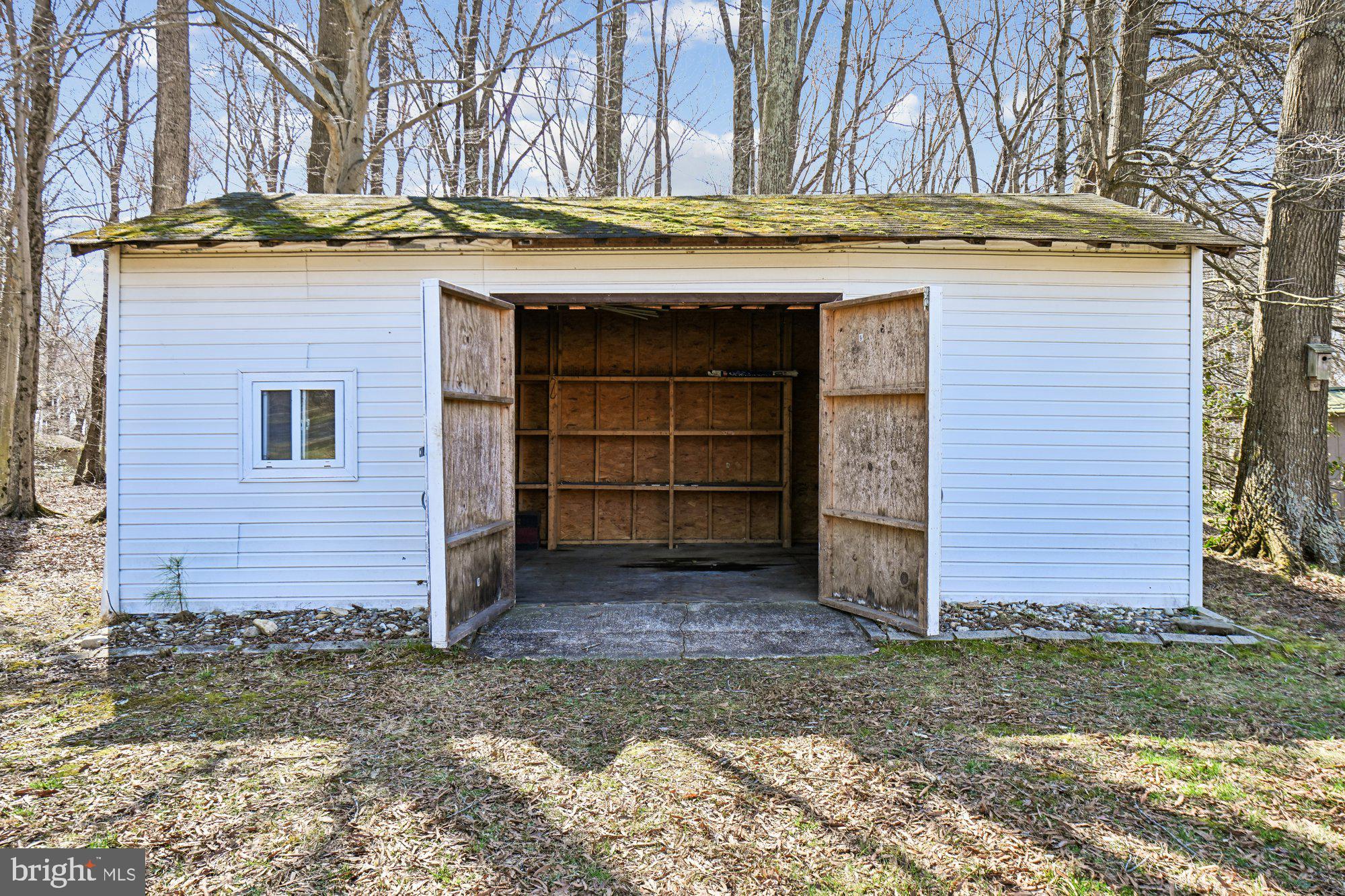 16601 Candy Hill Road Upper Marlboro, MD 20772 - Photo 44 of 55 a view of a stone house with a large door