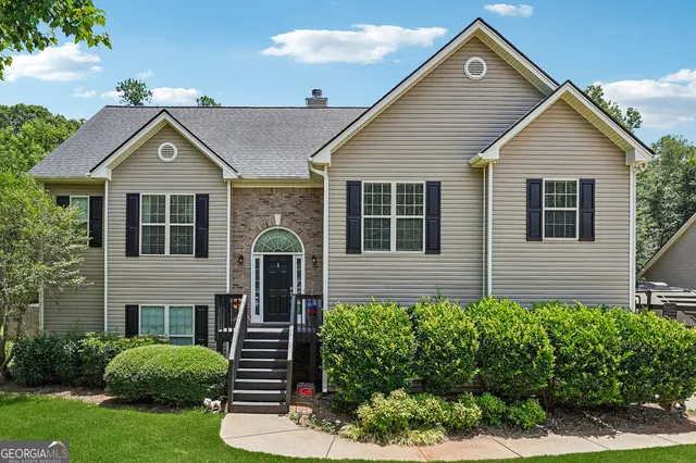 a front view of a house with garden