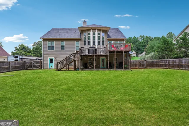 a front view of house with yard and outdoor seating