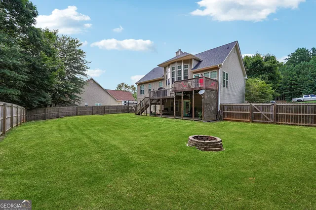 a front view of a house with backyard