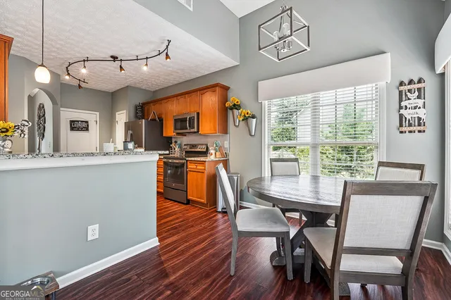 a view of a dining room with furniture window and wooden floor