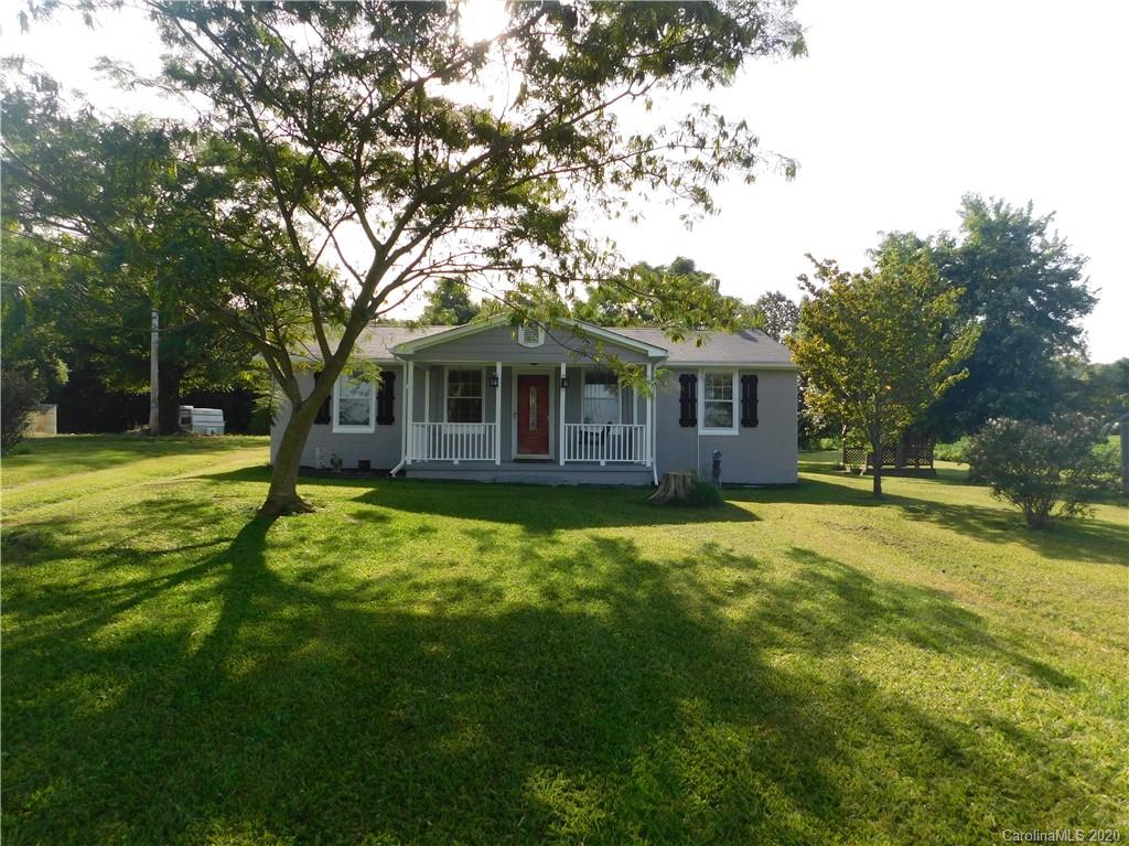 5411 Armfield Mill Road Monroe, NC 28112 - Photo 1 of 33 a front view of a house with a garden