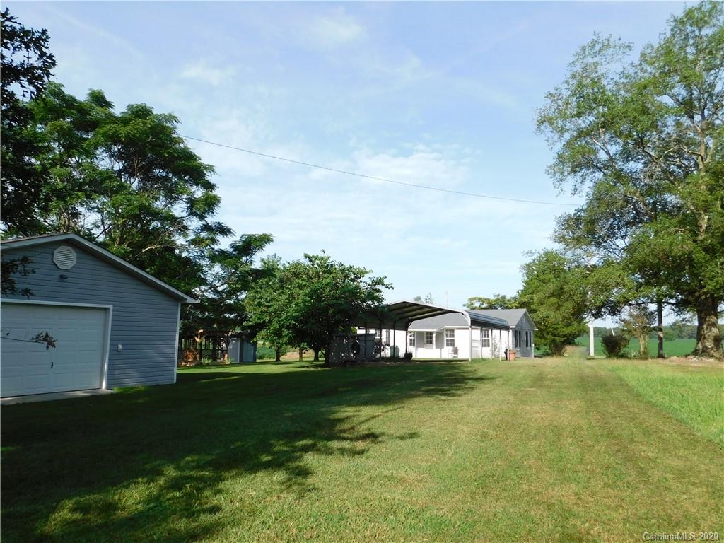 5411 Armfield Mill Road Monroe, NC 28112 - Photo 11 of 33 a view of a house with a yard